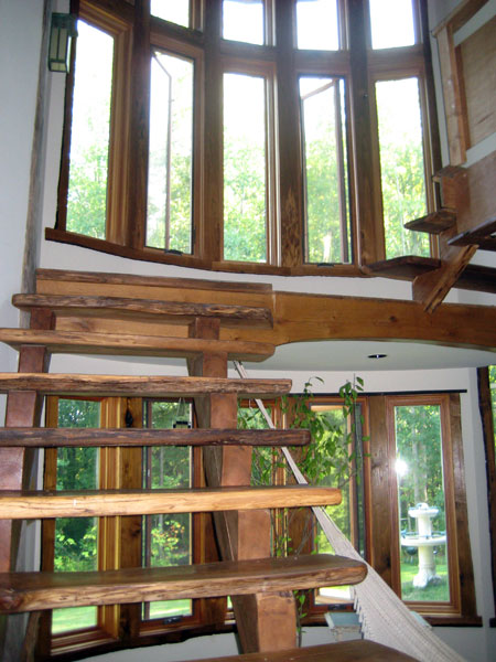 Bow windows and hand made stairs.